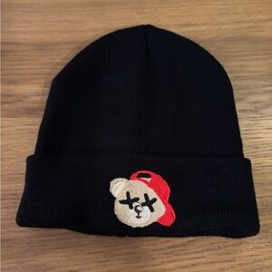 Kids black beanie with a bear wearing a red hat